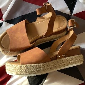 These sandals have never been worn woman’s size 5